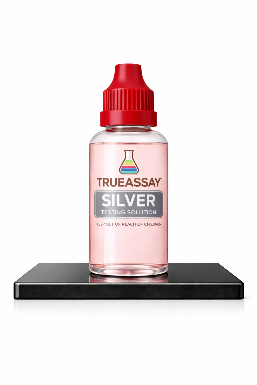 TrueAssay Silver Testing Solution bottle with red cap on a black testing stone